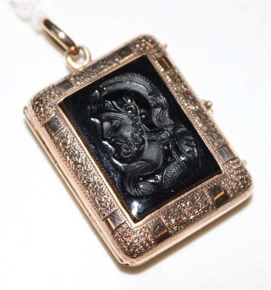 A late Victorian gold and black onyx inset pendant locket, approx. 1in.